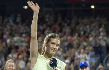 Tennis Thrills in Canada: Bouchard Bids Farewell, Swiatek Dominates, and Fritz Battles Rain to Advance