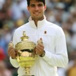 carlos-alcaraz-poses-with-the-gentlemens-single-tropy-at-wimbledon-2024